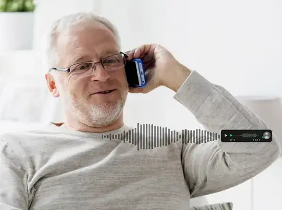 Smiling man talking on the phone using Voice to Voice Verbis Translation Technology