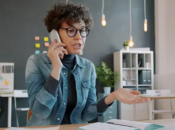 Woman speaking to a customer support center Photo by Vitaly Gariev
